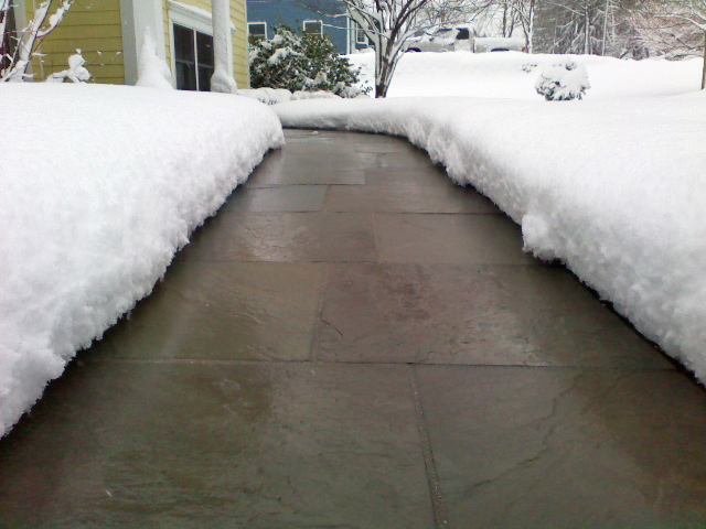A radiant heated sidewalk after a snowstorm.